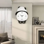 Modern panda-shaped wall clock in a stylish living room setting.