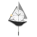 Modern decorative wall clock with geometric design and pendulum.