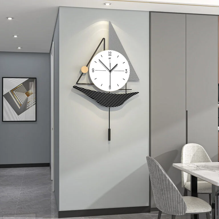 Modern wall clock with geometric design in a contemporary dining room setting.
