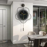 Modern luxury wall clock with unique design in a stylish dining area.