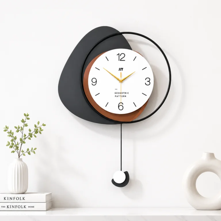 Modern decorative wall clock with geometric design and pendulum, styled with vases and books on a shelf.