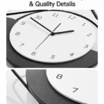 Modern luxury wall clock with black and white design, showcasing premium craftsmanship.