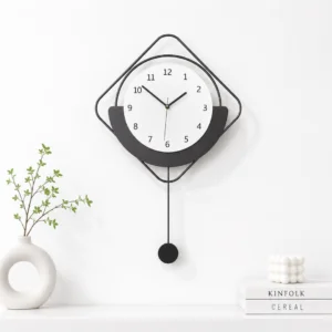 Modern black and white wall clock with minimalist design and decorative accents.