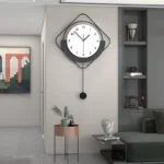 Modern wall clock with geometric design in a stylish living room setting.