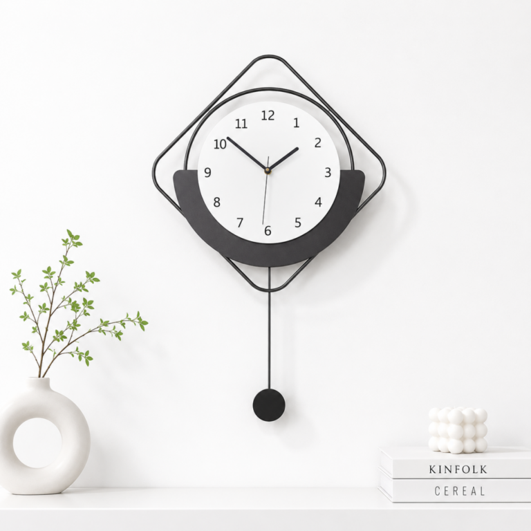 Modern black and white wall clock with minimalist design and decorative accents.