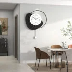 Modern wall clock in a stylish dining room with contemporary decor and elegant furniture.
