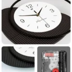 Modern decorative wall clock with black and white design, featuring a unique circular frame.