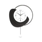 Modern decorative wall clock with abstract design and black accents.