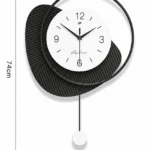 Modern black and white wall clock with unique geometric design and pendulum.