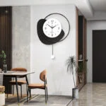 Modern luxury wall clock with unique design in a stylish dining area.