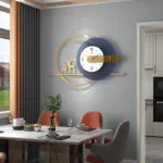 Modern luxury wall clock with gold accents in a stylish dining room setting.