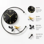 Modern decorative wall clock with gold accents and bird design, featuring a glass dial and metal frame.