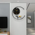 Modern decorative wall clock with bird design in a luxury home interior.
