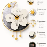 Modern decorative wall clock with floral and star design, featuring a glossy glass dial and metal pendulum.