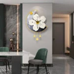 Modern decorative wall clock with floral design in a luxury home interior.