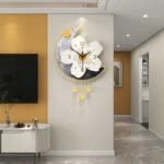 Modern decorative wall clock with floral design and crescent moon shape in a luxury living room.
