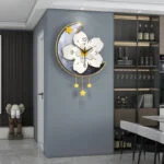 Modern decorative wall clock with floral design and star accents in a luxury home setting.