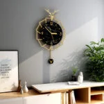 Modern luxury wall clock with gold accents and black marble design in a stylish home setting.