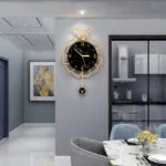 Modern luxury wall clock with gold accents in a stylish living room setting.