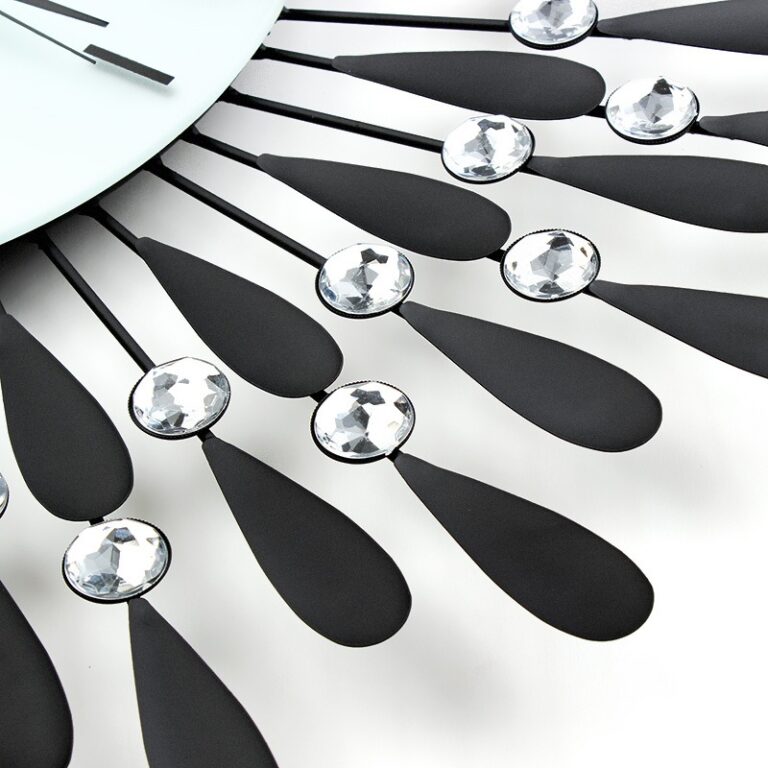 Modern decorative wall clock with crystal accents and black metal design.