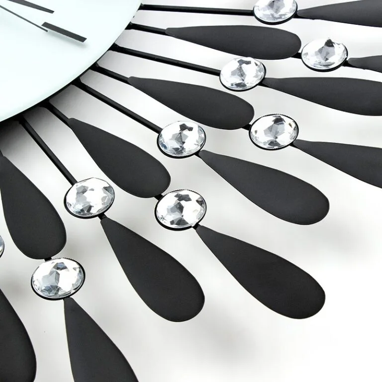 Modern decorative wall clock with crystal accents and black metal design.
