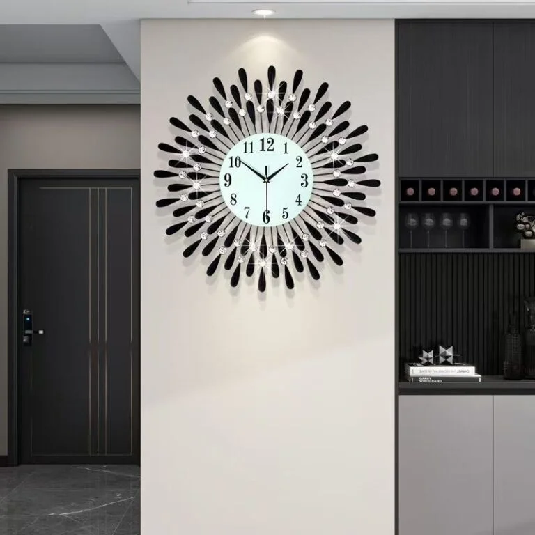 Modern decorative wall clock with black and silver accents in a luxury home setting.