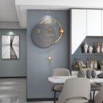 Modern luxury wall clock in a stylish home interior with decorative accessories.