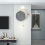 Modern luxury wall clock with gold accents in a stylish living room.