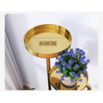 Gold decorative stand with blue flowers, modern home decor.