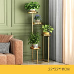 Modern gold metal indoor planter with multiple levels for home decor.
