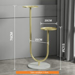 Modern gold metal planter stand with two tiers, ideal for luxury home decor.