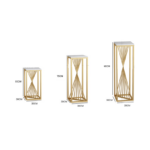 Set of three gold metal and marble pedestals for modern home decor.