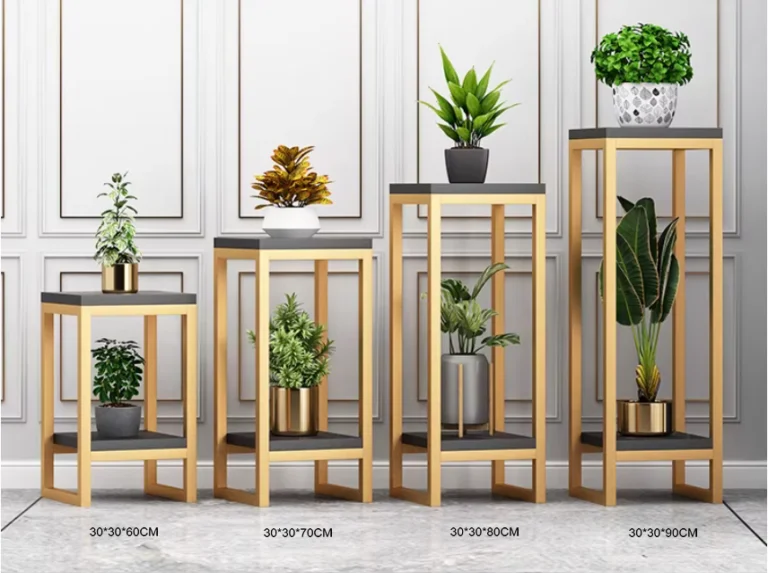 Modern gold and black plant stands with decorative indoor planters and green plants.