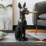 Black Doberman decorative sculpture with gold accents in modern living room.
