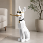 Modern geometric dog sculpture with sunglasses and gold tray in a luxury living room.