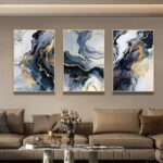 Modern luxury wall art in a living room with abstract designs and gold accents.