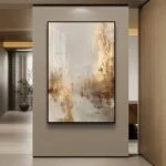 Modern luxury wall art in hallway, featuring abstract design with gold and neutral tones.