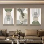Modern framed wall art with abstract designs in a luxury living room setting.