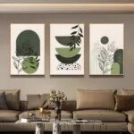 Modern framed wall art with abstract green designs in a luxury living room.