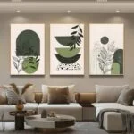 Modern framed wall art with abstract green designs in a luxury living room setting.