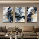 Modern luxury wall art in a living room with abstract designs and gold accents.