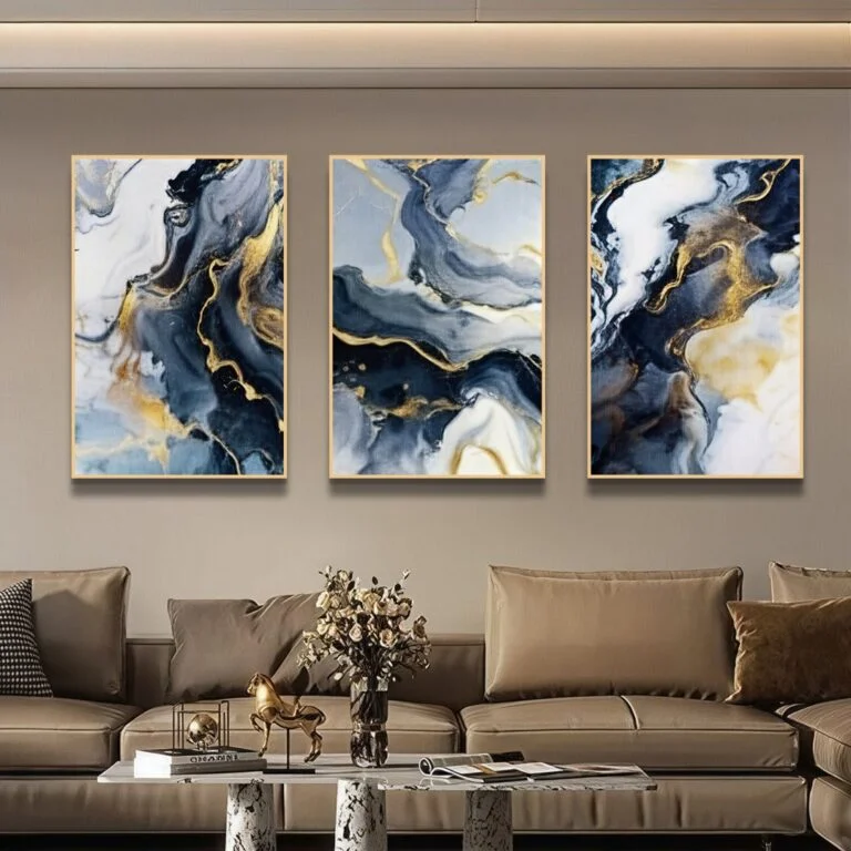 Modern luxury wall art in a living room with abstract designs and gold accents.