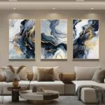Modern luxury home decor with abstract framed wall art in a stylish living room.
