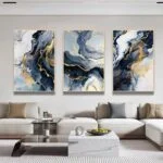 Modern luxury living room with abstract framed wall art and elegant decor.