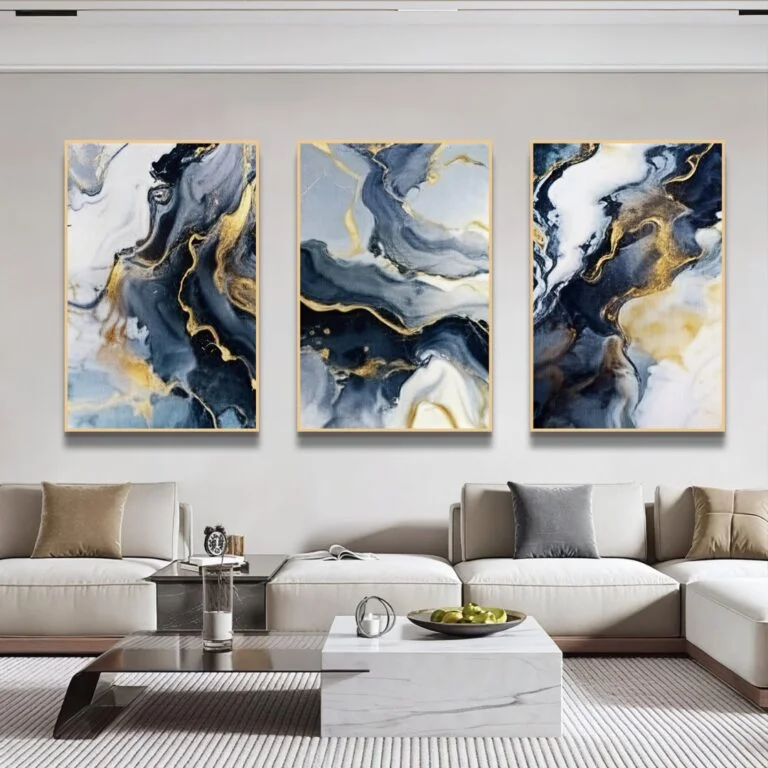 Modern luxury living room with abstract framed wall art and elegant decor.