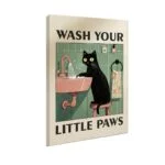 Modern wall art featuring a black cat washing paws in a sink, text reads 'Wash Your Little Paws'.