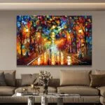 Modern luxury home decor with vibrant framed wall art above a sofa.