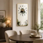 Modern luxury wall clock with gold frame and botanical design in elegant dining room.