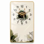 Modern Islamic wall clock with Kaaba design, gold accents, and floral motifs.