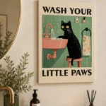 Modern wall art with a black cat washing paws, perfect for bathroom decor.